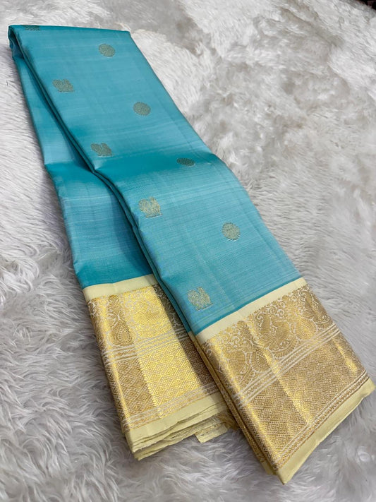 Aqua blue korvai Kanjivaram silk saree with muted antique gold zari and heritage ivory border