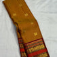 Pure silk Kanchipuram saree in Honey Brown with Arakku Red, traditional handwoven border and zari detail