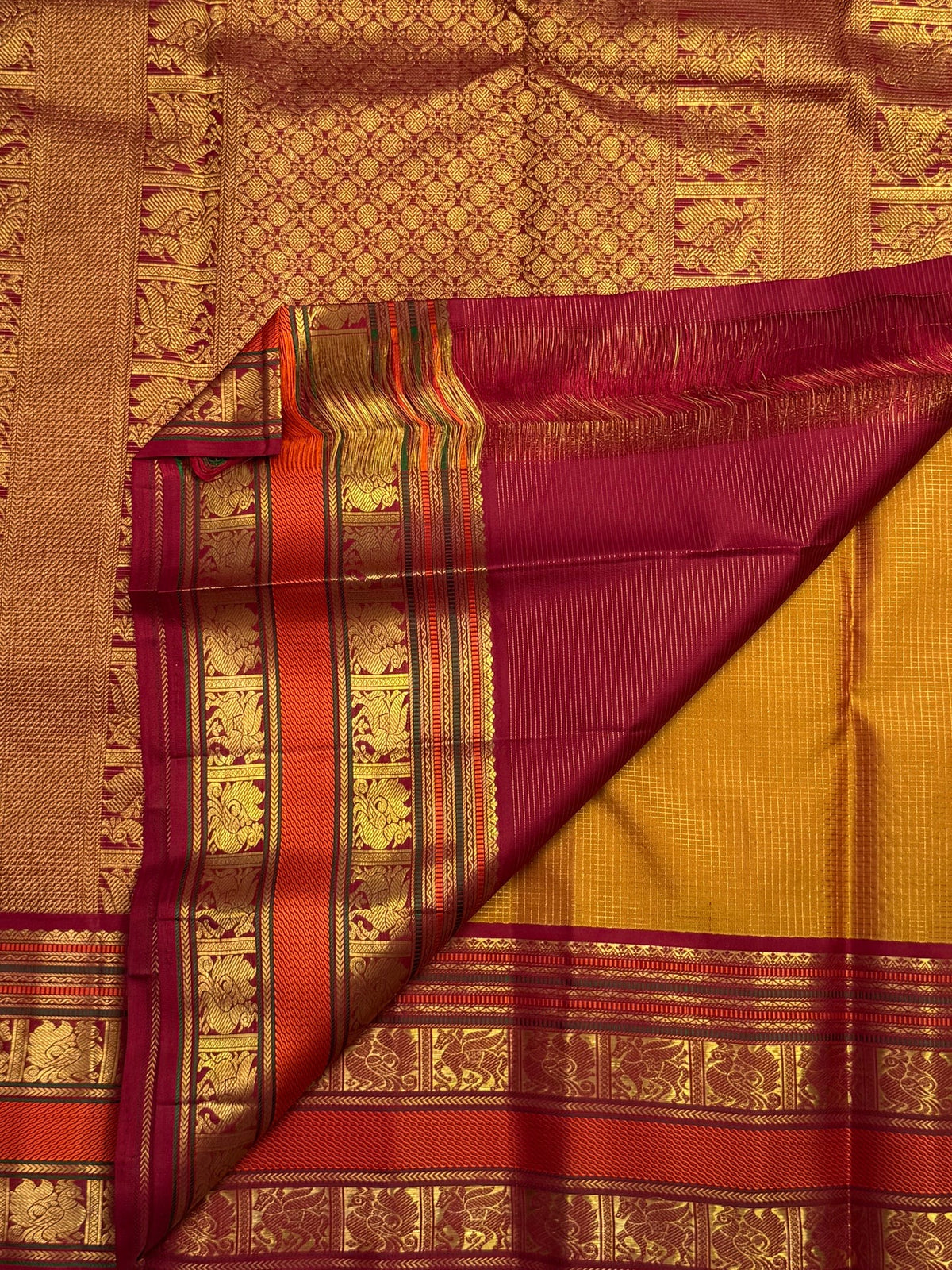 Pure silk Kanchipuram Zari Kattam saree with gold zari highlights on brown silk