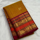 Honey Brown with Arakku Red Kanchipuram silk saree with the body details of its Zari Kattam design