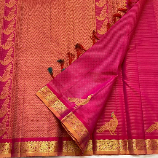 Handwoven hot pink KanchiPattu pure silk saree with fine Vairaoosi zari shimmer body and contrast copper border