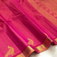 Gold zari temple motif border detail of handwoven hot pink and copper KanchiPattu pure silk saree