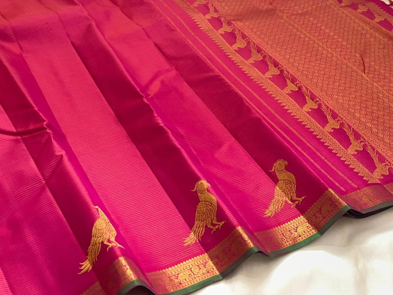 Handwoven hot pink Kanchipuram pure silk saree with fine Vairaoosi zari shimmer body and contrast forest green border
