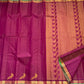 Folded hot pink Kanjipuram pure silk saree showing Vairaoosi zari shimmer body and green contrast border