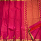 Detail of fine Vairaoosi zari lines woven continuously across hot pink Kanchipuram pure silk body