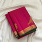 Folded hot pink Kanchipuram pure silk saree showing Vairaoosi zari shimmer body and green contrast border