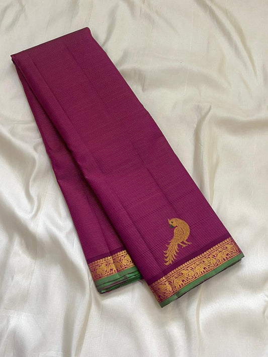 Handwoven hot pink Kanjipuram pure silk saree with fine Vairaoosi zari shimmer body and contrast forest green border