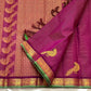 Gold zari temple motif border detail of handwoven hot pink and green Kanjipuram pure silk saree