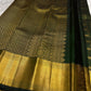 Thick Varisaipet gold zari border detail on hunter green Kanjivaram saree