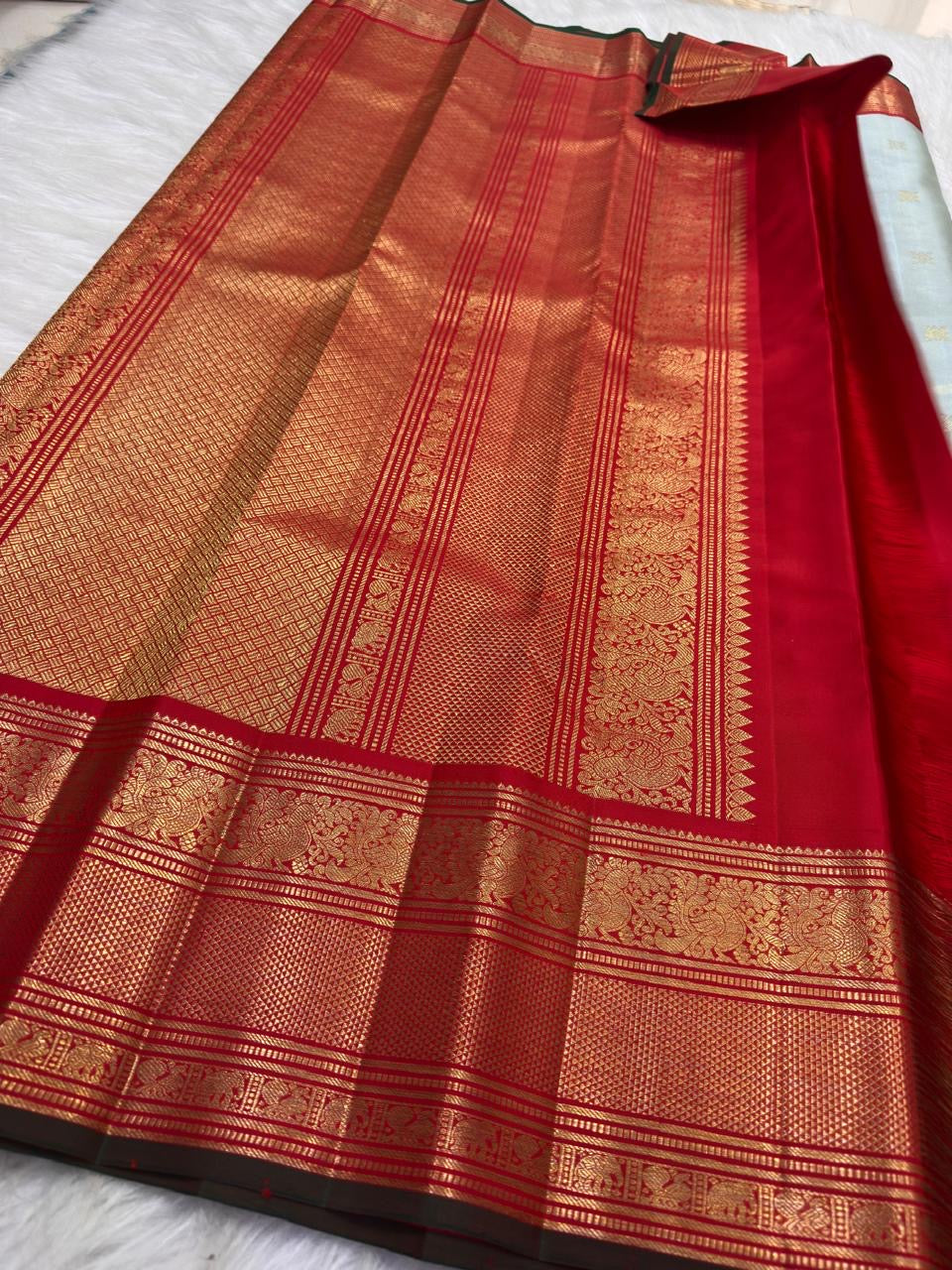 Ice blue tissue Kanjipuram silk saree with red and gold zari border
