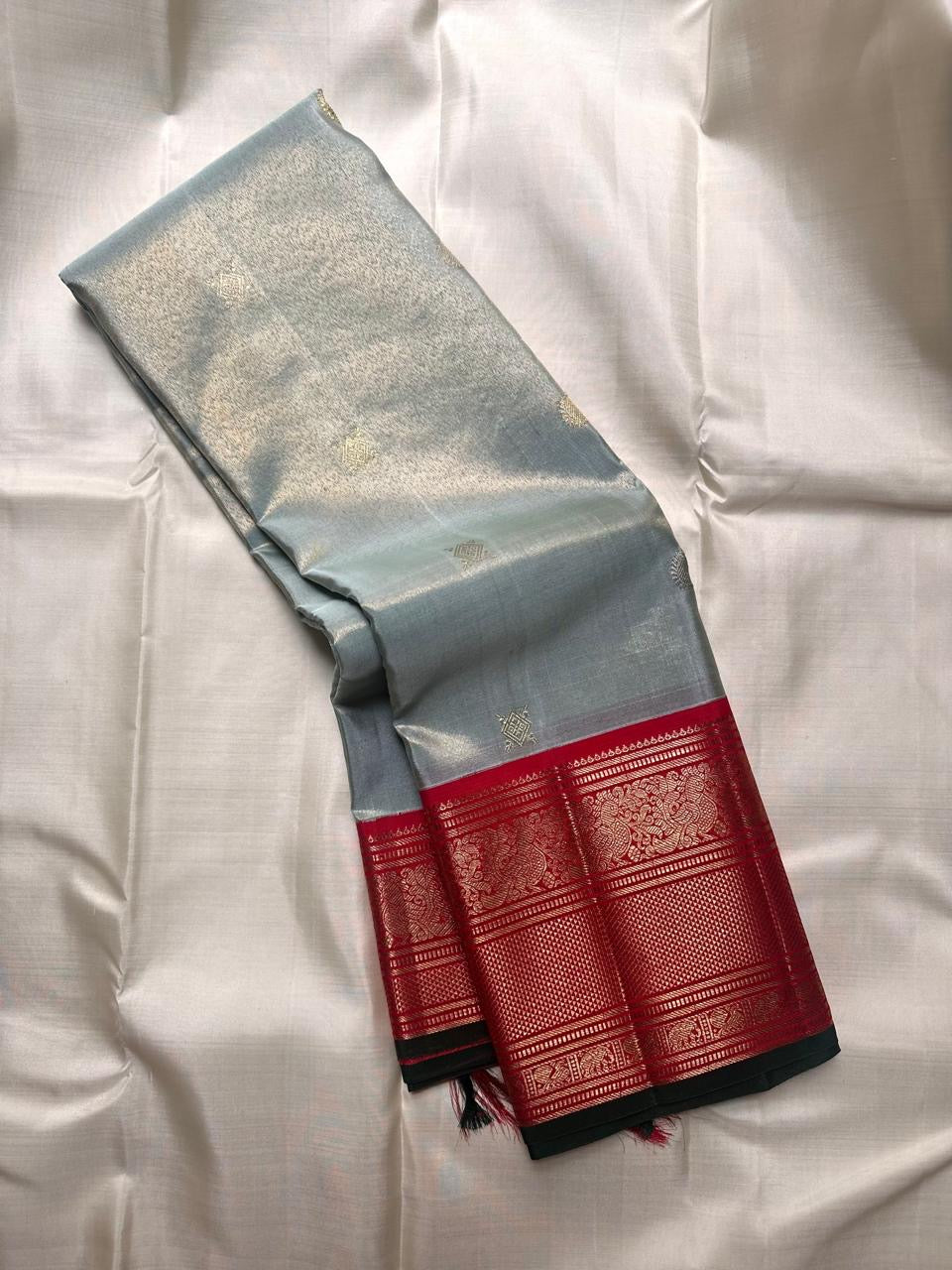 Ice blue tissue pure silk Kanjivaram Korvai saree with red gold zari border