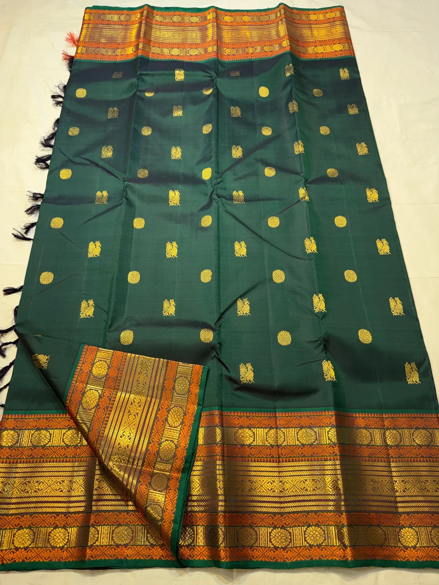Deep Bottle Green and Amber Kanchipuram Silk Saree – Folded Display View