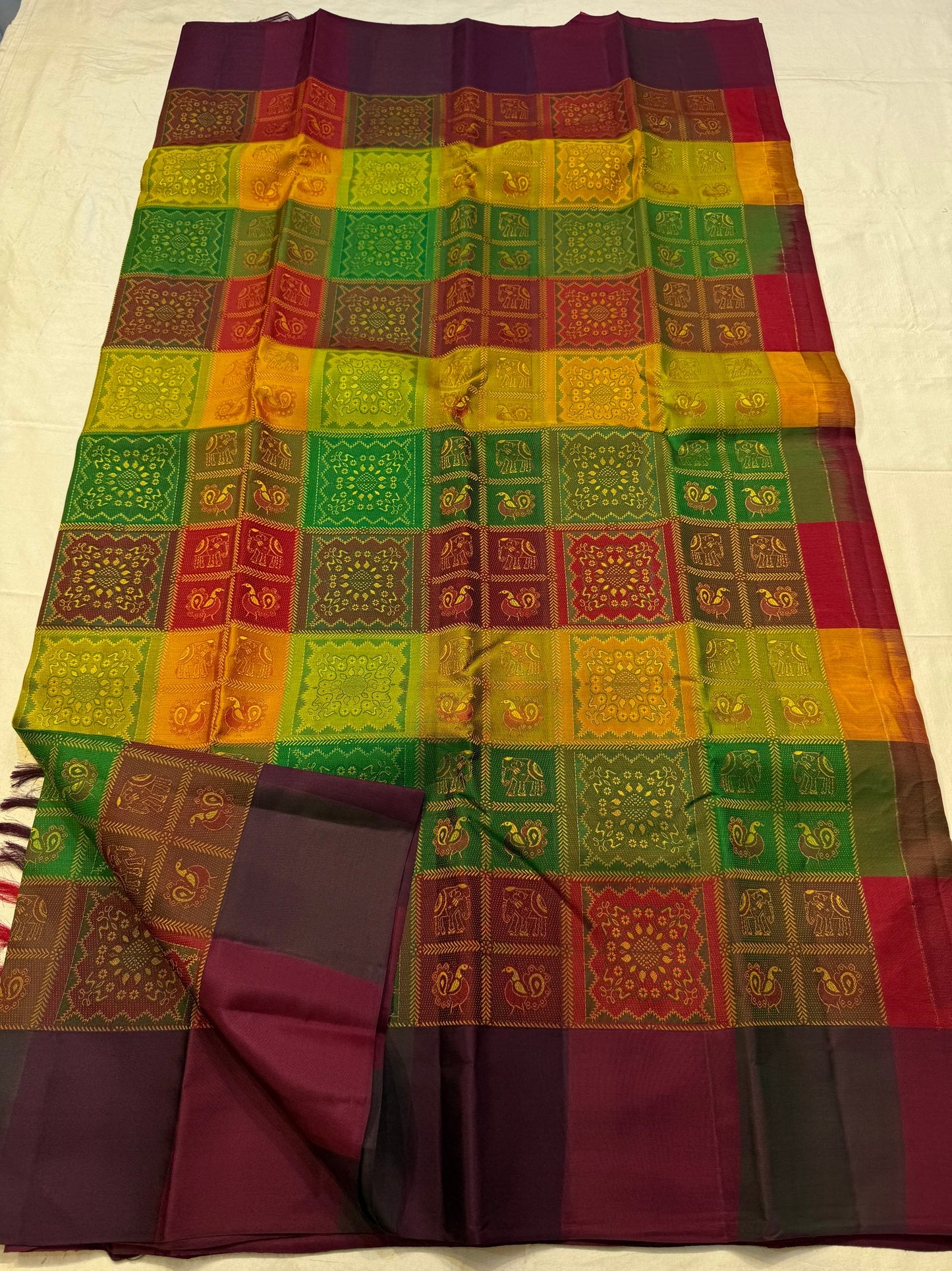 Elephant and peacock motif panel on forest green Kanjivaram pure silk saree Idam Living