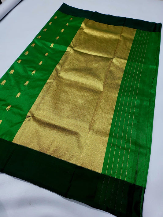 Emerald green Chanderi silk saree folded view with butti motifs and zari border