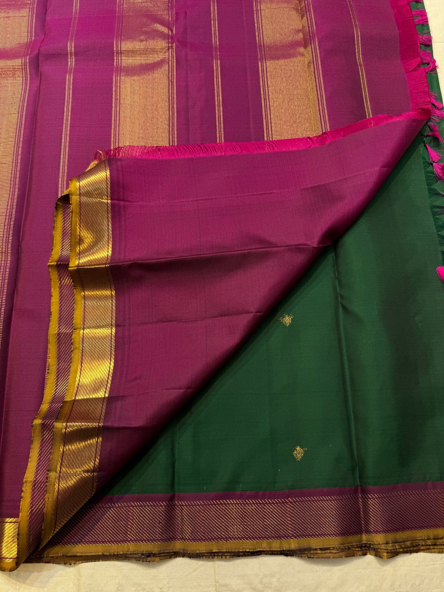 Handwoven emerald green Kanjivaram silk saree with traditional zari border – Idam Living