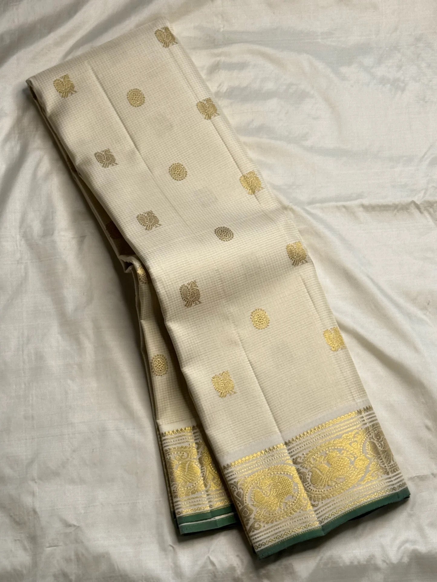 Ivory handwoven Pure Silk Kanjeevaram saree, full drape, gold zari motifs