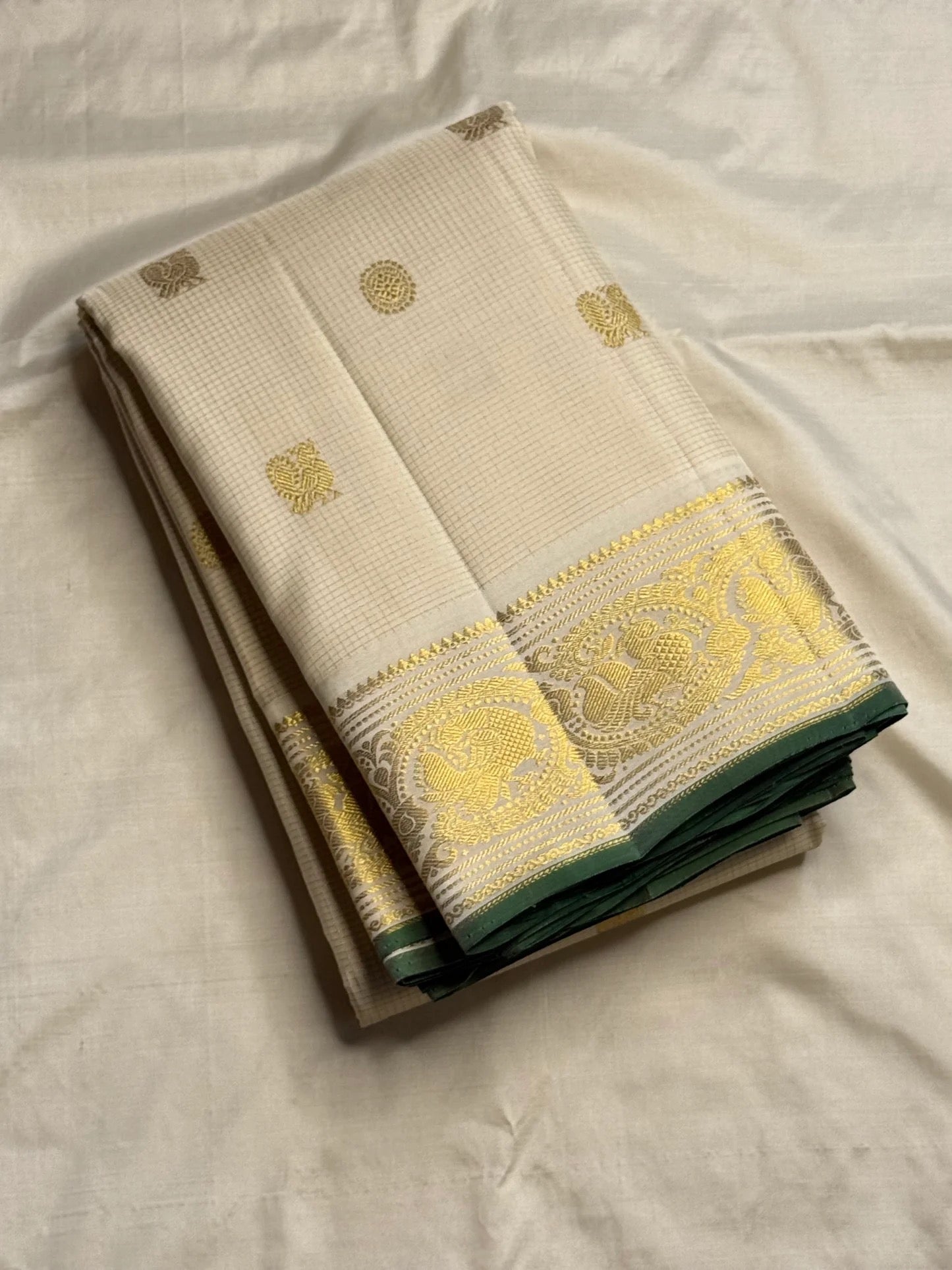 Ivory Kanjeevaram silk saree border with gold zari peacock motifs