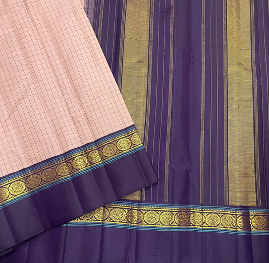 Pastel pink Kanchipuram silk saree with structured kanchi kattam grid pattern and deep blue gold zari border