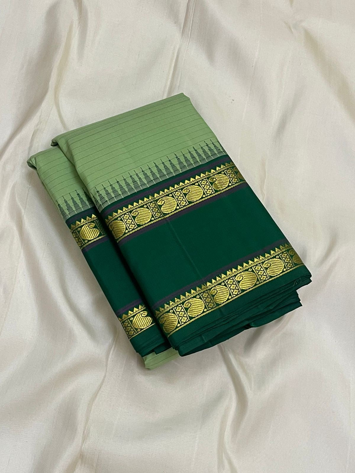 Pure Kanchipuram Silk Saree Sage Green and Dark Green with Traditional Gold Zari Border folded view