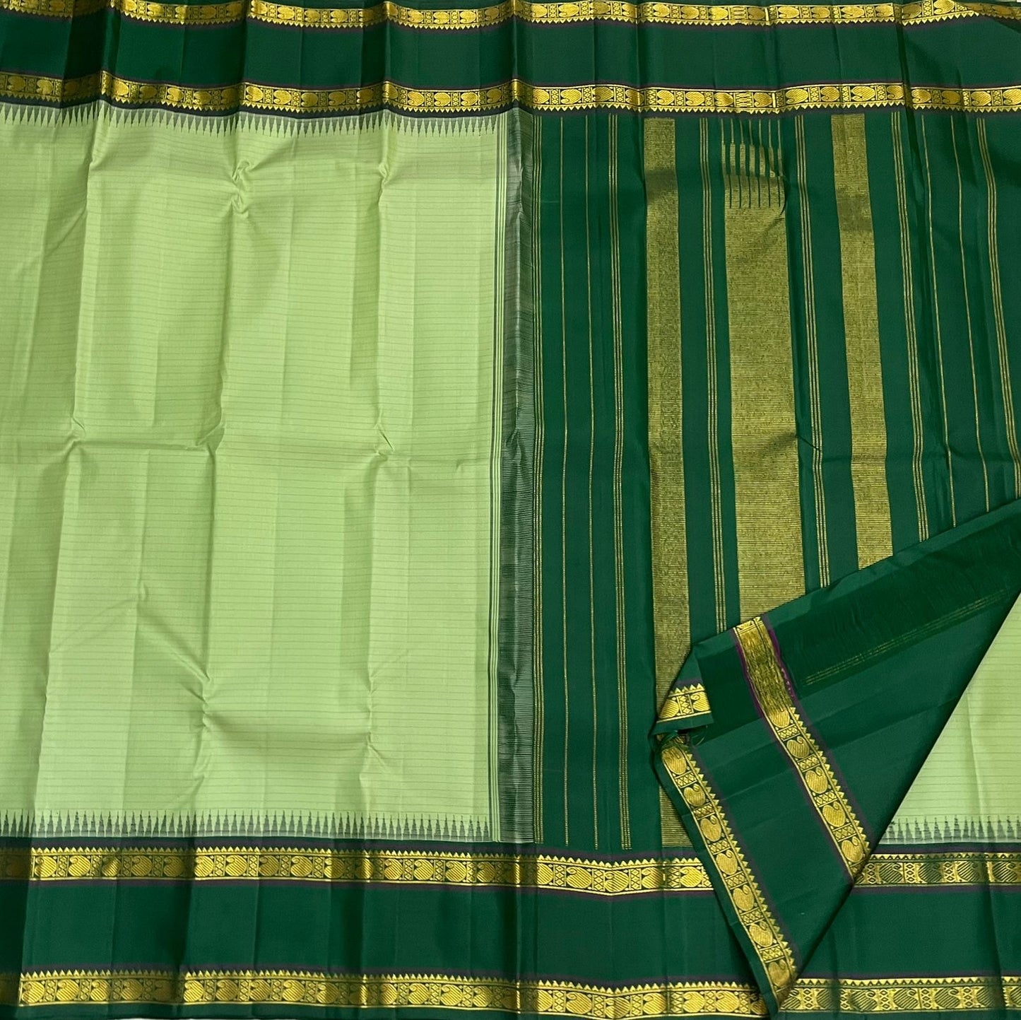 Pure Kanchipuram Silk Saree Sage Green and Dark Green with Traditional Gold Zari Border draped view