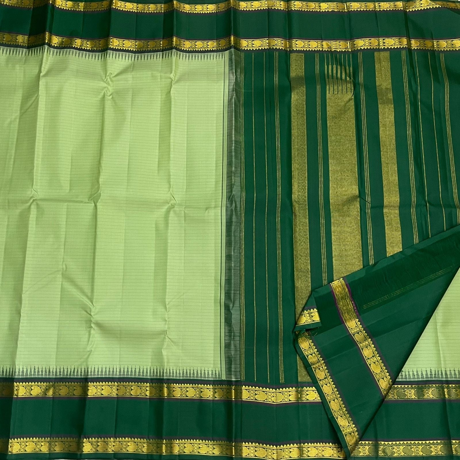 Pure Kanchipuram Silk Saree Sage Green and Dark Green with Traditional Gold Zari Border draped view