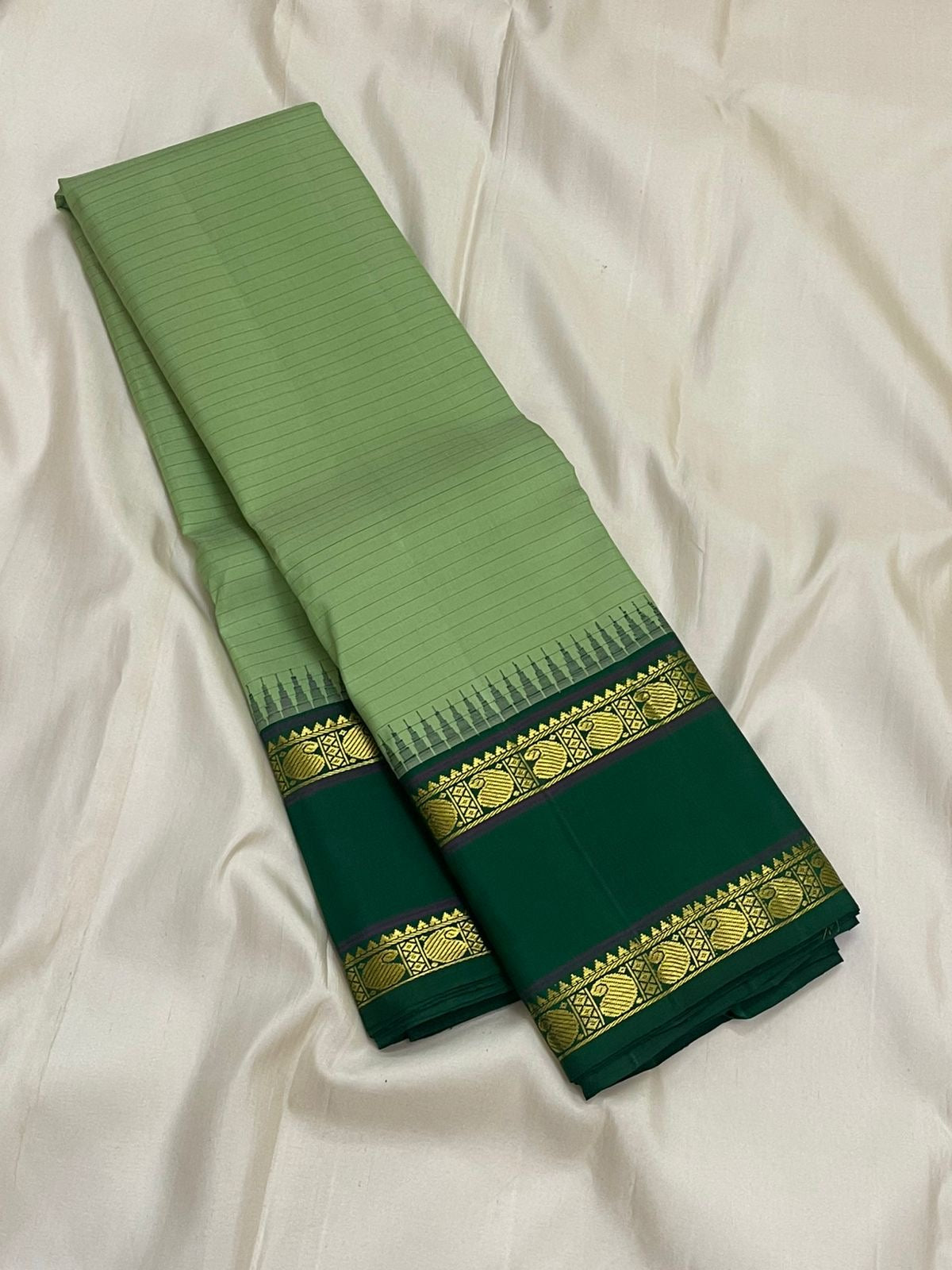 Pure Kanchipuram Silk Saree Sage Green and Dark Green with Traditional Gold Zari Border body texture detail