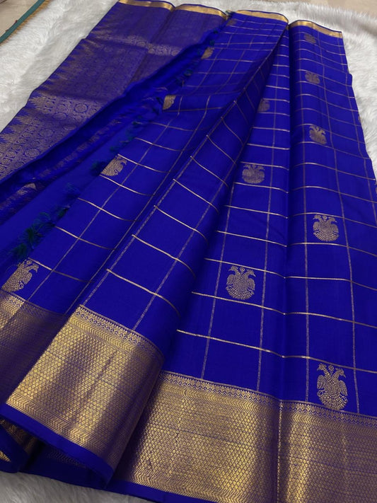 Pure Kanchipuram silk saree in deep blue with traditional gold zari kattam checks by Idam Living