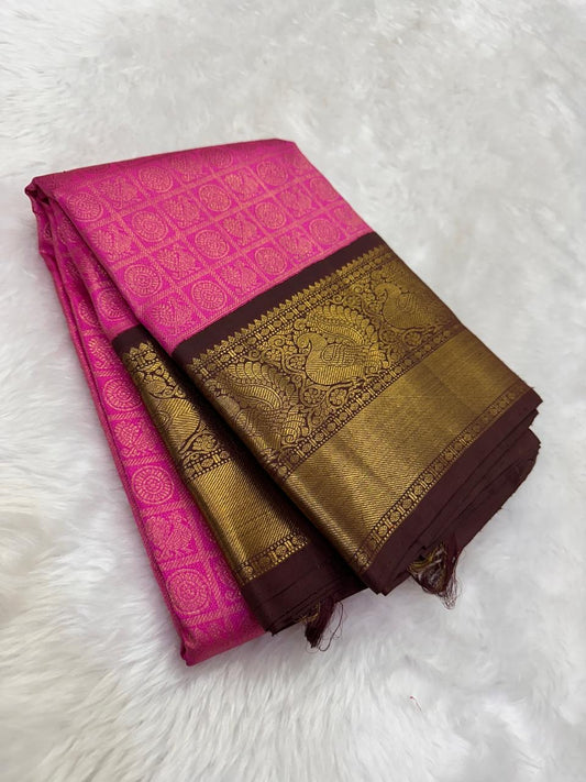 Pink zari kattam pure Kanchipuram silk saree with antique gold peacock border folded view