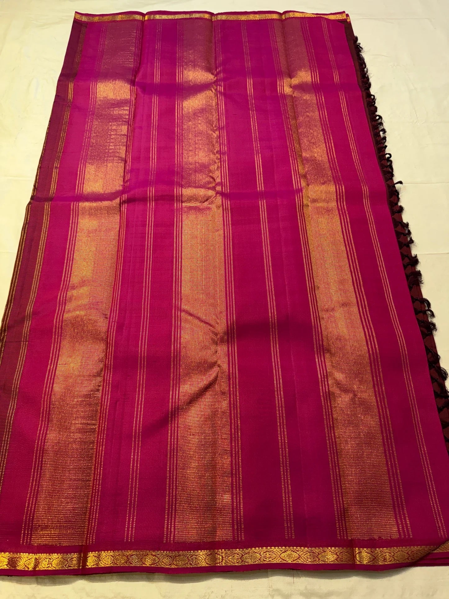 Vibrant magenta zari border on deep maroon Kanchipattu silk saree Idam Living