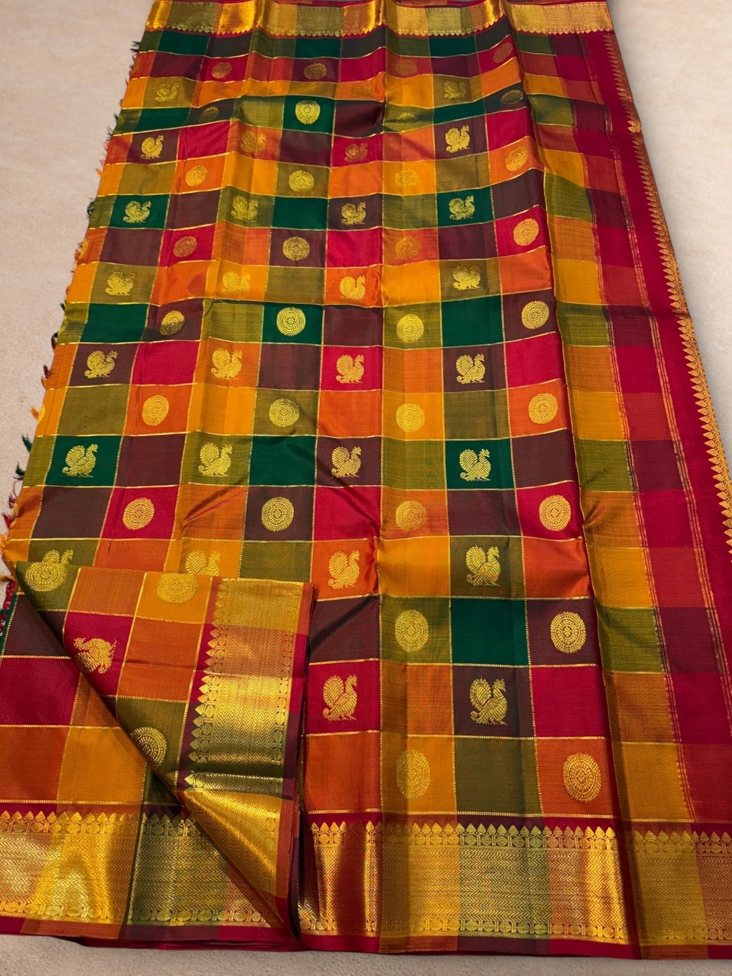 Antique gold zari border Kanchipuram silk saree border detail with multicolour checks