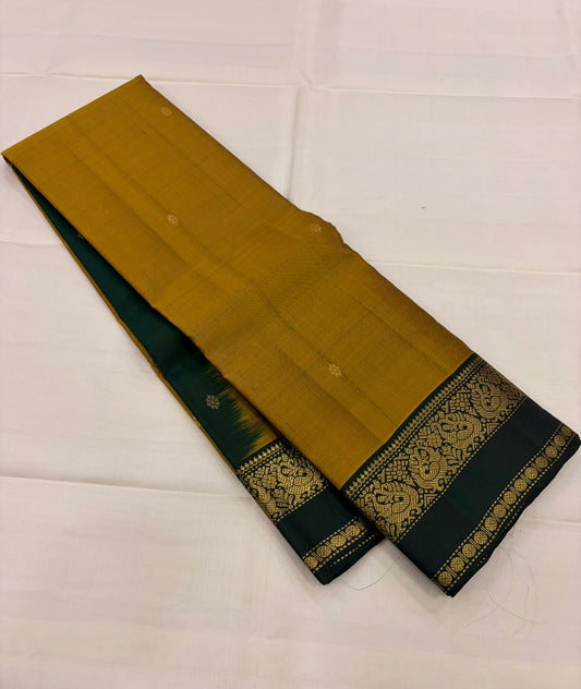 Mustard and Dark Green Handwoven Pure Silk Kanchipuram Saree with Zari Peacock Border.
