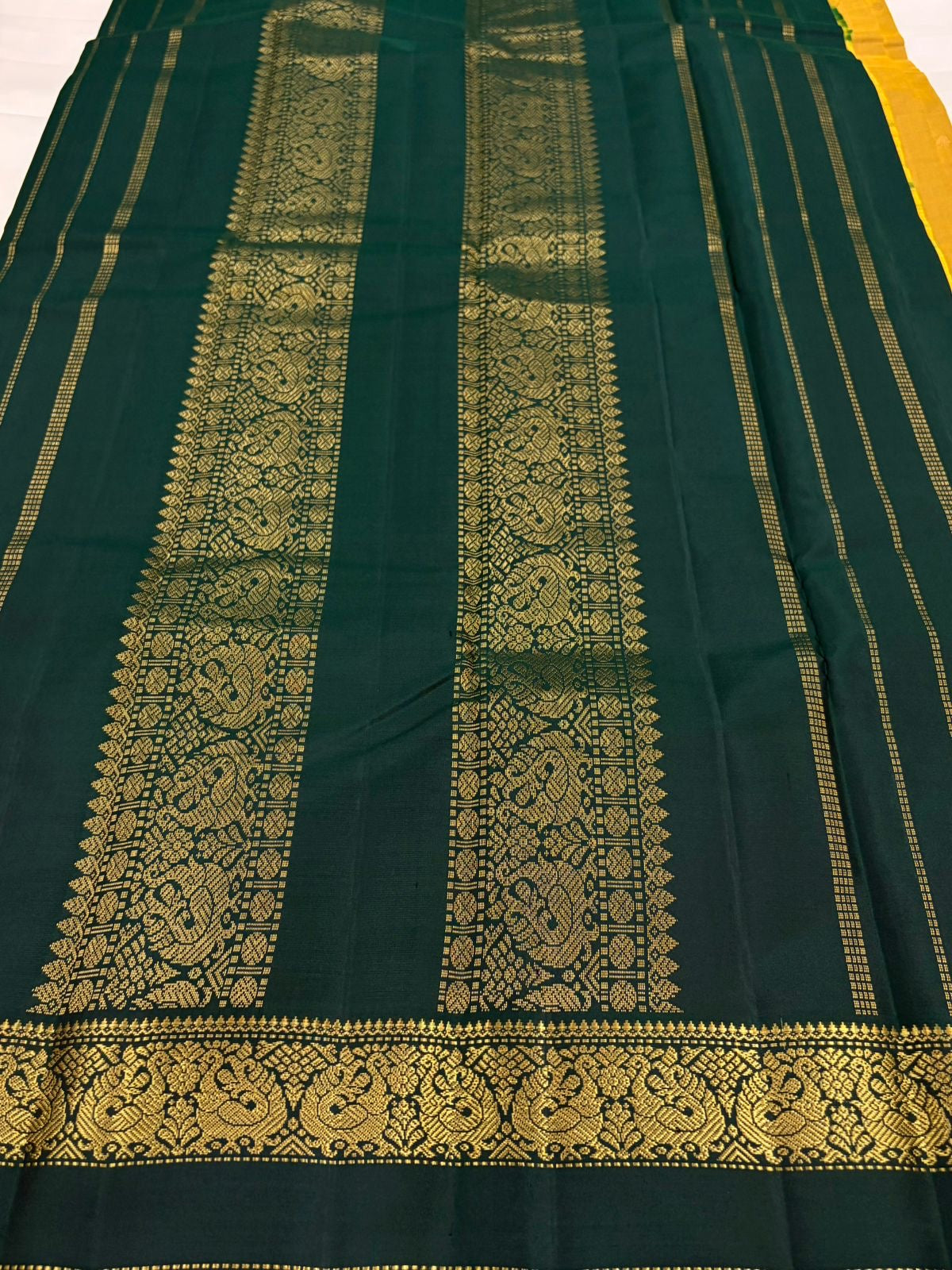 Mustard and Dark Green Handwoven Pure Silk Kanchipuram Saree with Zari Peacock Border.