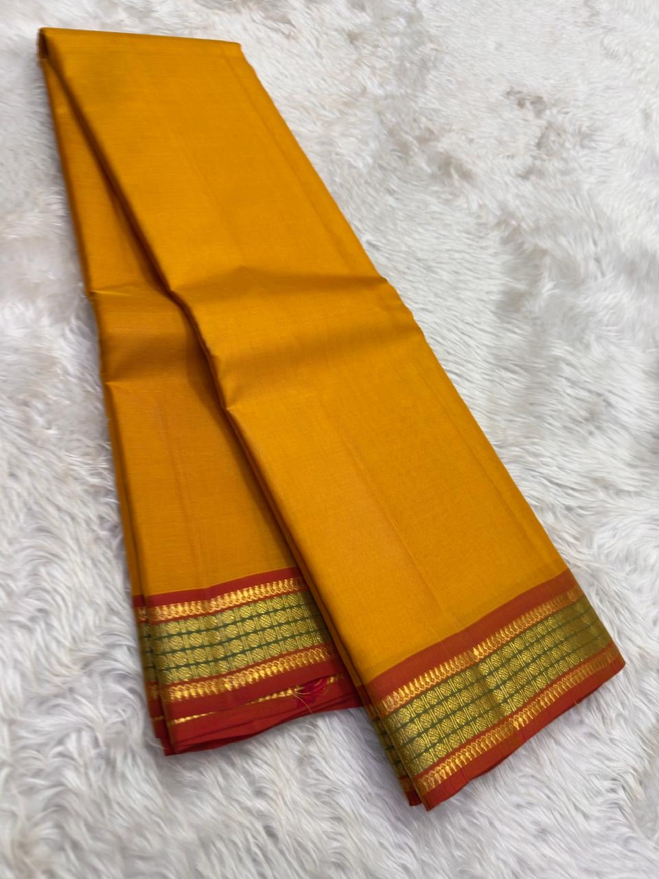 Mustard and Rust Handwoven Pure Silk Kanchipuram Saree with Gold Zari Band Border.