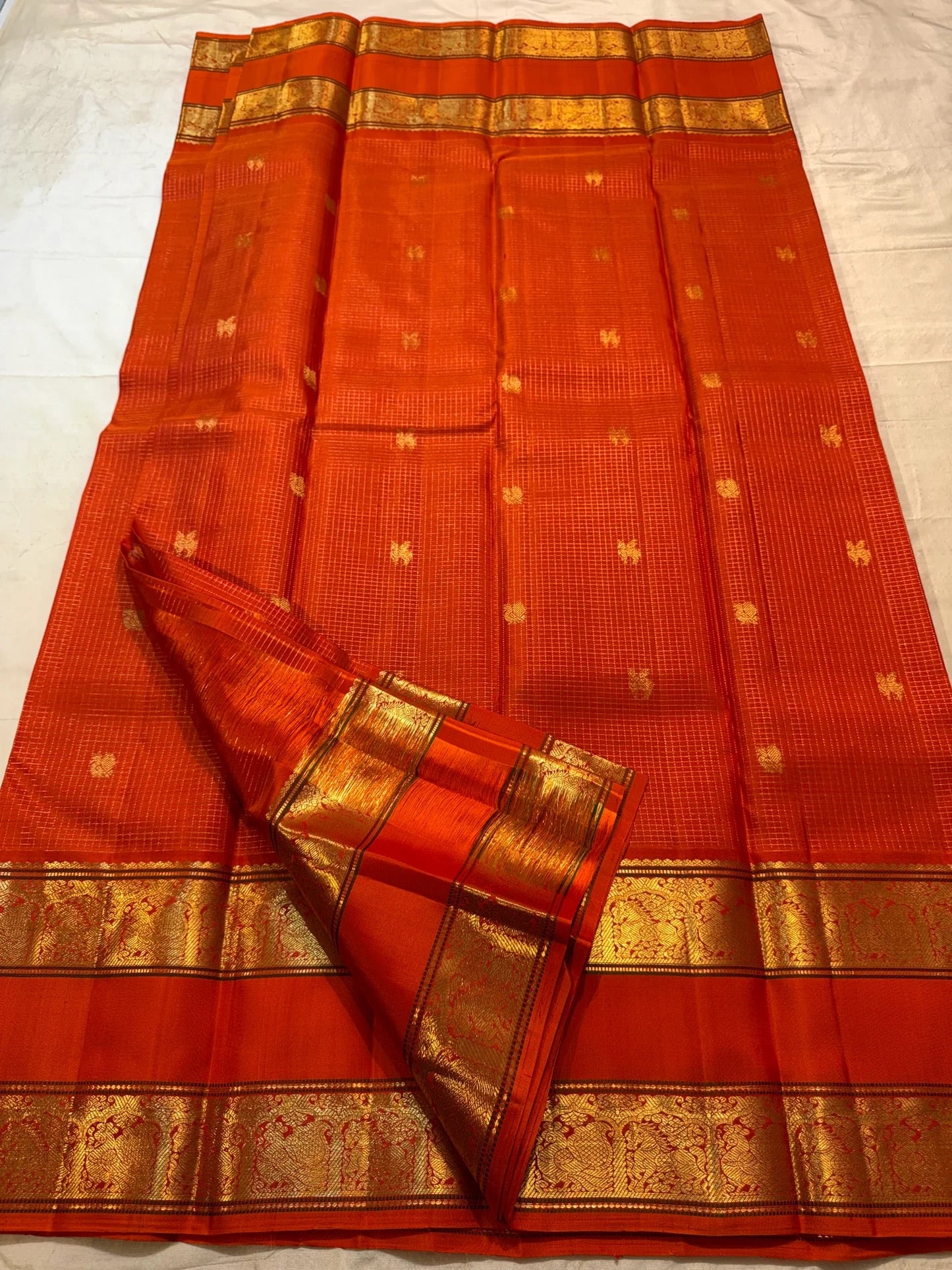 Burnt Orange Kancheepuram saree pallu with peacock and horse zari motifs