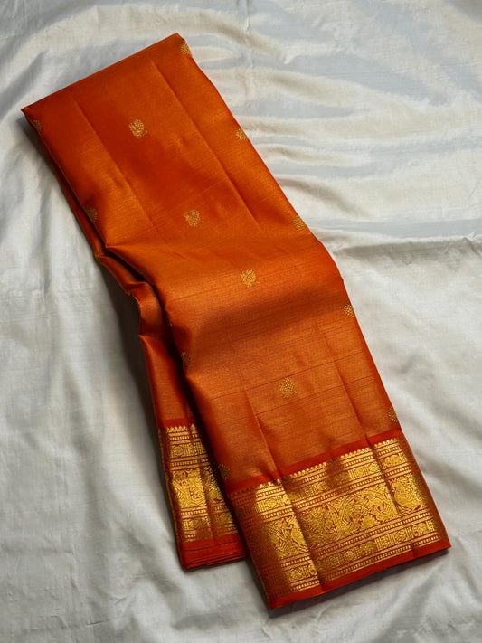 Sunset Orange Vairaoosi Kanjivaram saree grand gold zari border detail