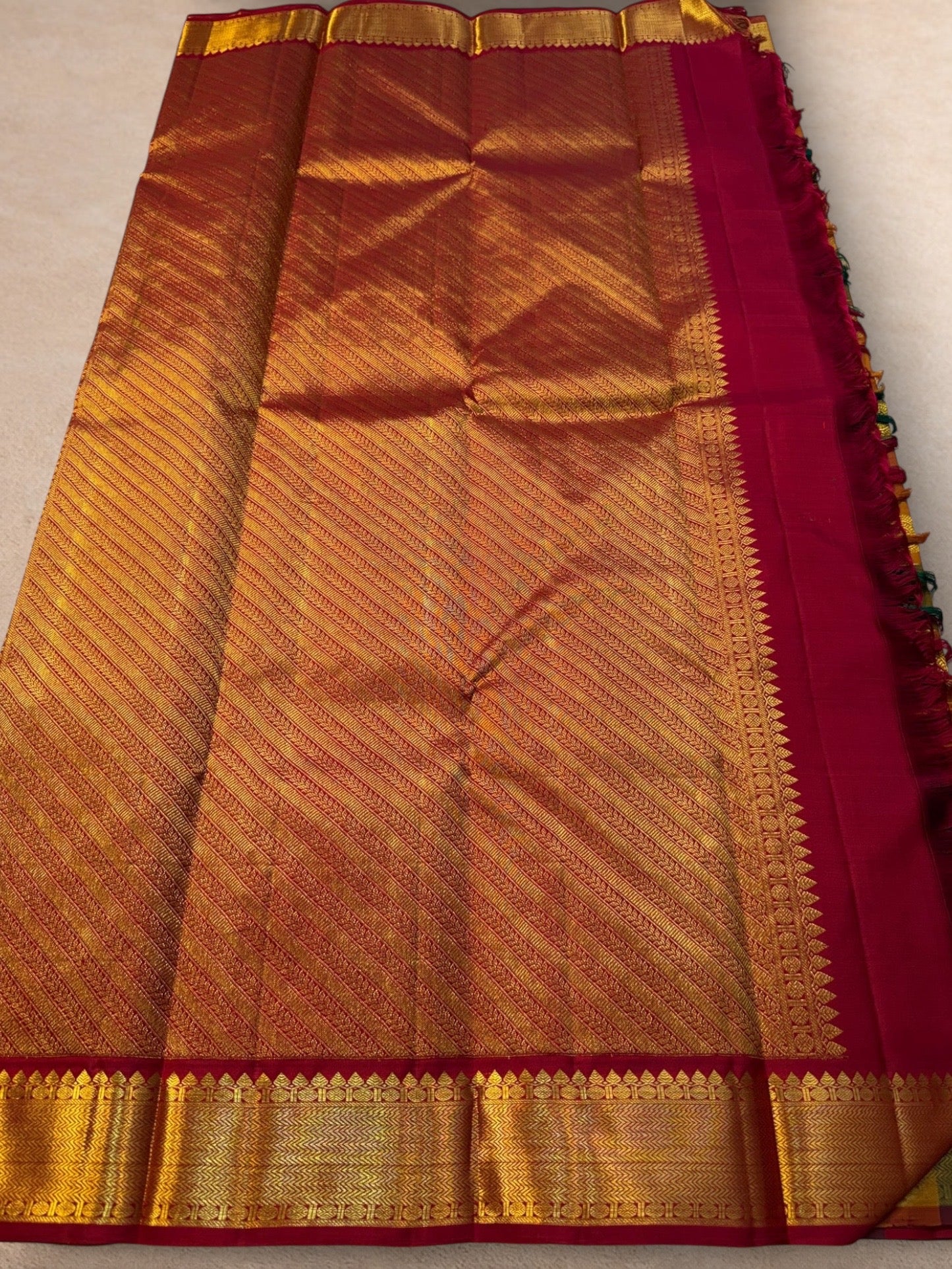 Multicolour checks Kanchipuram silk saree with peacock zari motifs body detail
