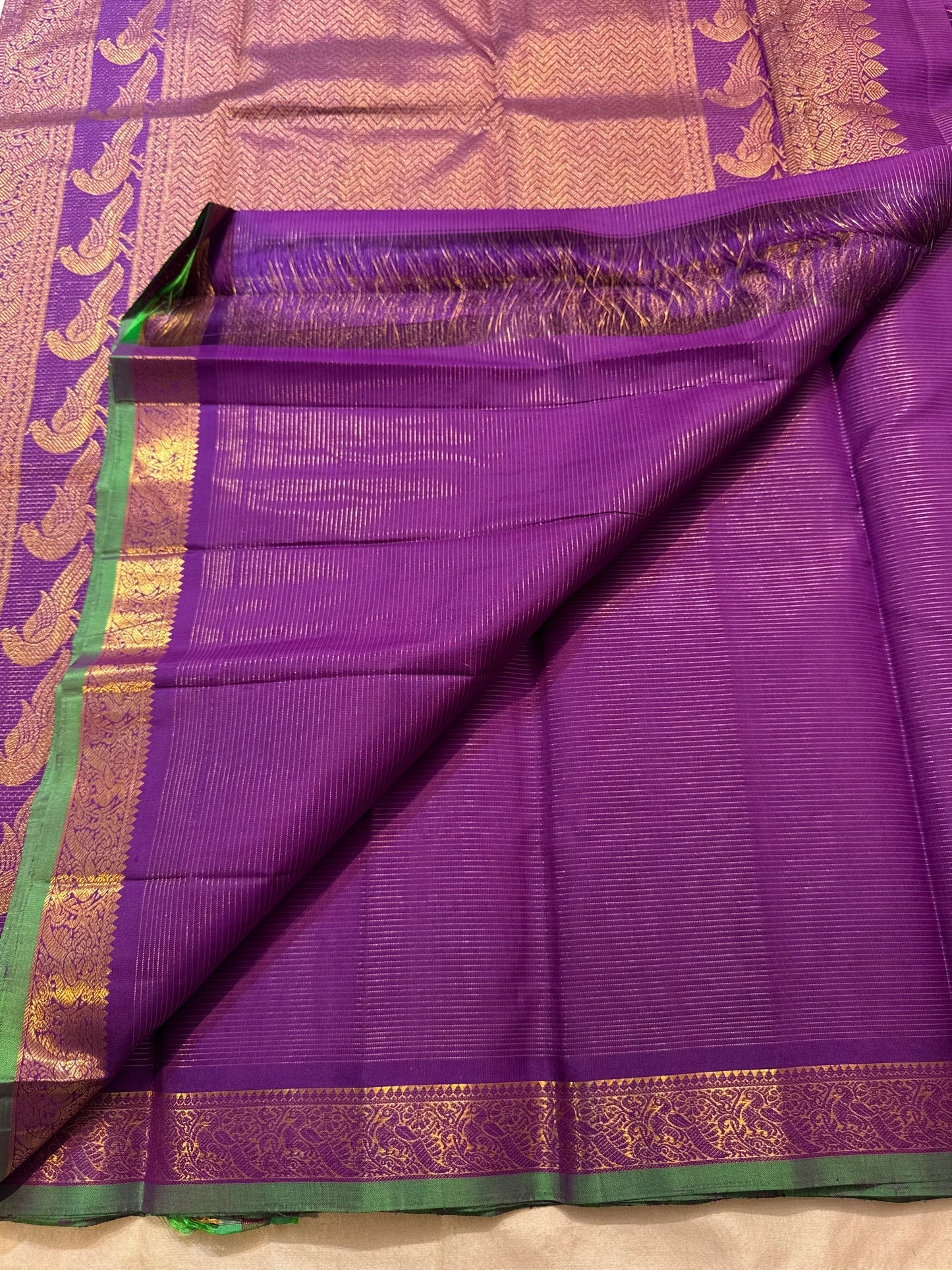 Purple Kanjipuram silk saree pallu with handwoven Mayil peacock panels