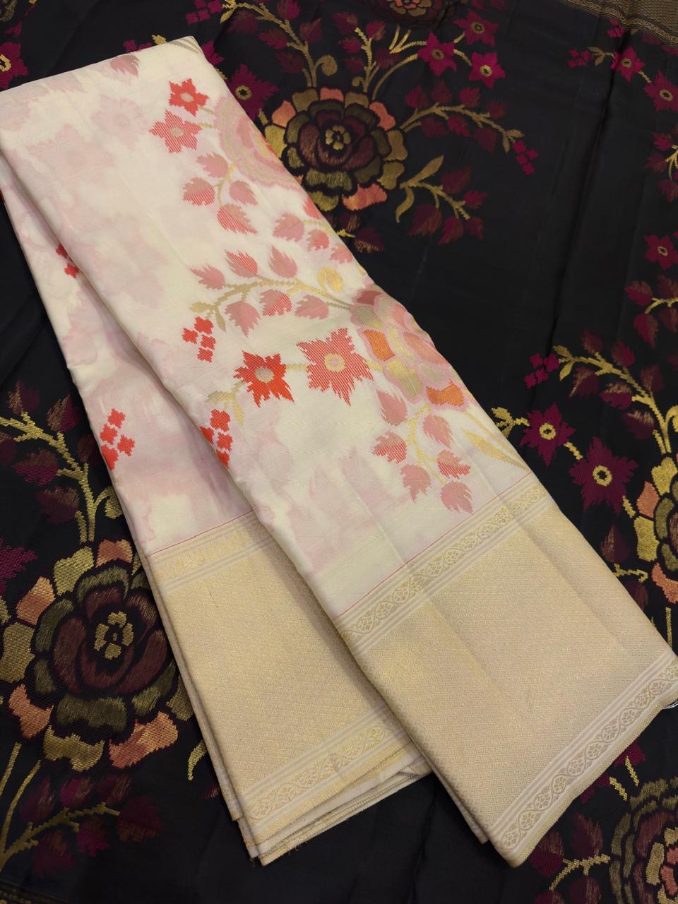 Close view of soft multicolour floral zari jaal woven across Pearl Ivory pure silk.