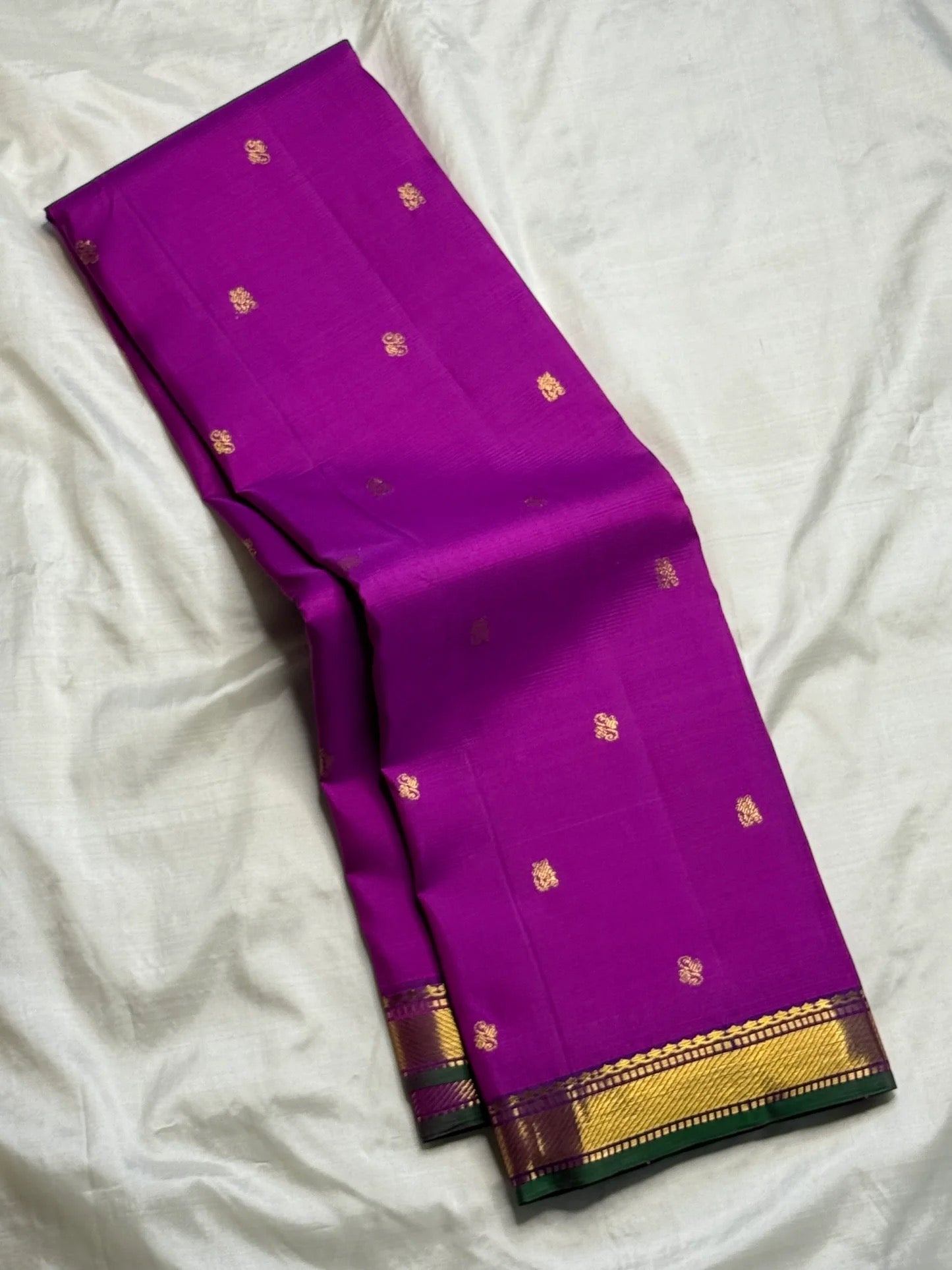 Handwoven Kanjivaram silk saree in royal orchid purple with floral buttas and emerald green border, shipped from New Jersey USA