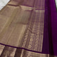 Vadamalli Purple contrast Kanjivaram border with antique-gold elephant motifs.