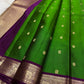 Green pure silk Butta saree with Vadamalli Purple elephant motif border.