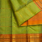 Handwoven ilampachai Pure Silk Kanchipuram Vairaoosi saree with soft green body and peach-gold contrast.