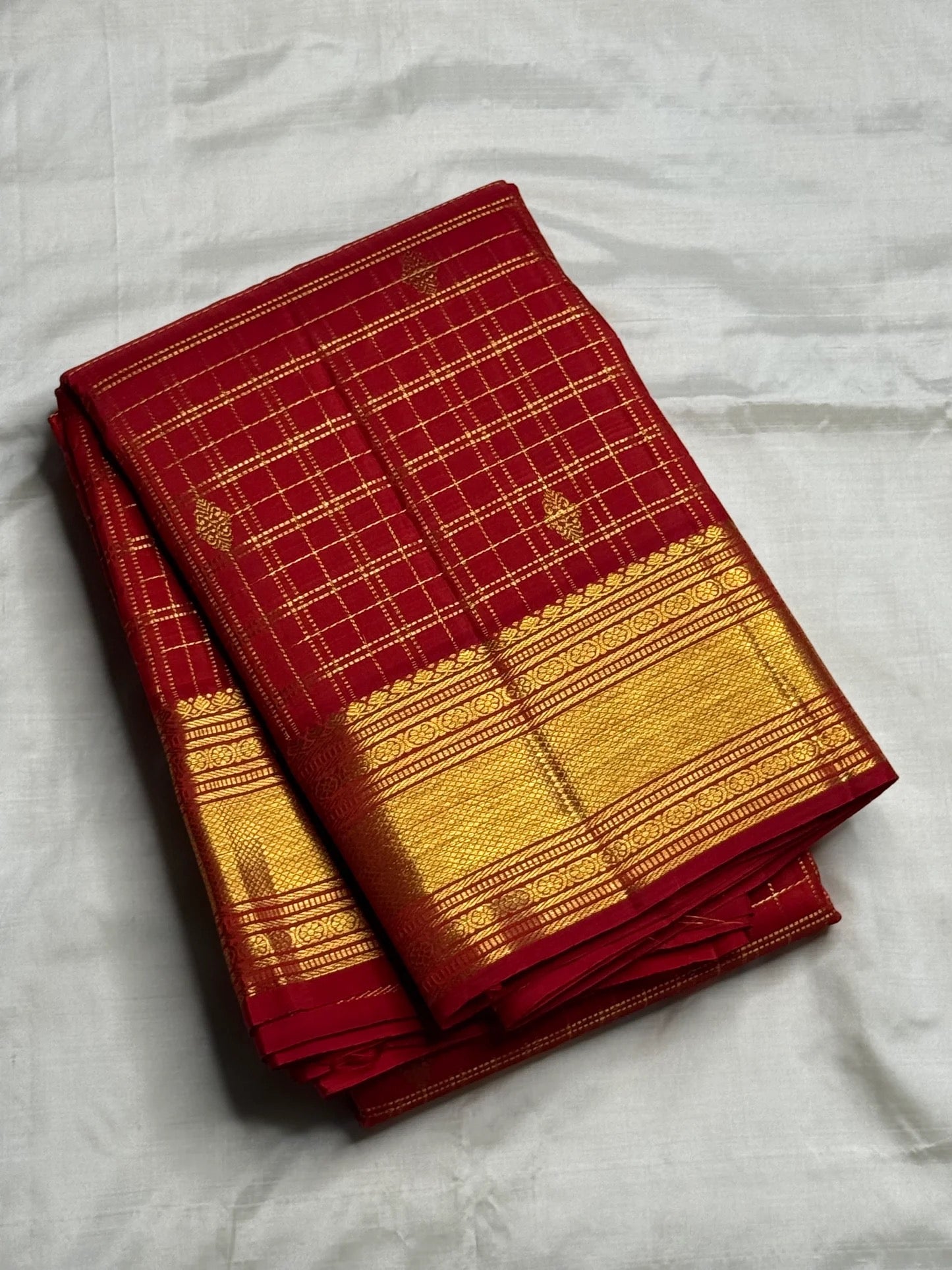 Luxury Kanjivaram silk saree in deep kumkum red with heirloom gold zari craftsmanship