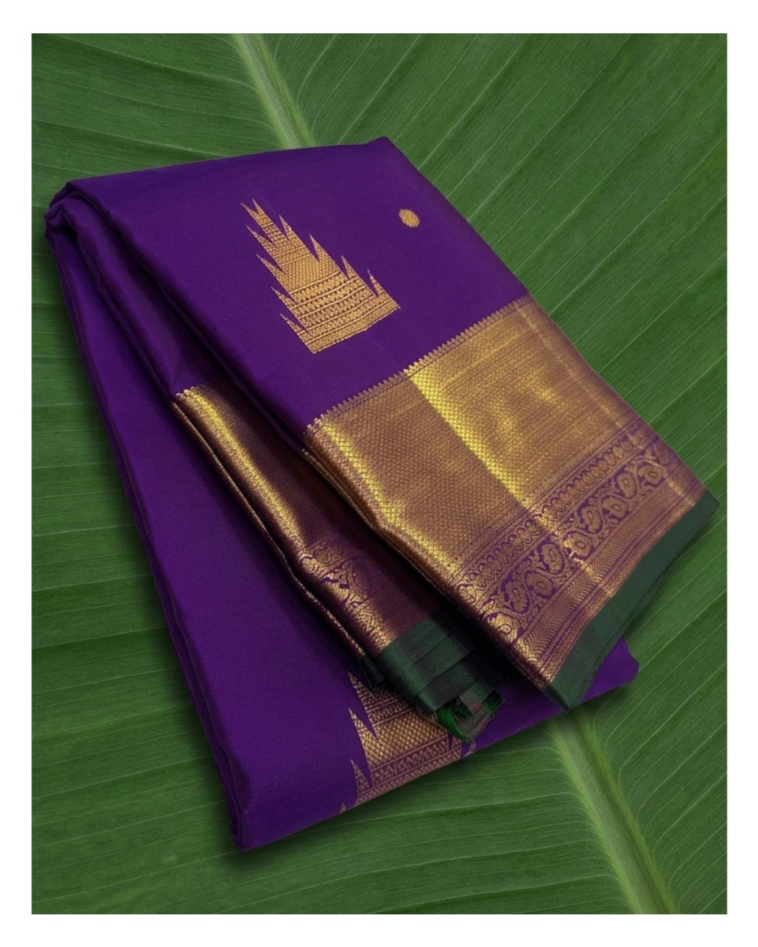 Imperial violet Kanchipuram silk saree with intricate thazampoo reku and traditional zari border