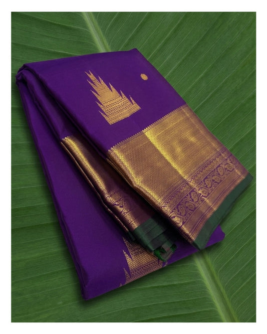 Imperial violet Kanchipuram silk saree with intricate thazampoo reku and traditional zari border