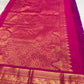Traditional violet silk saree with richly detailed korvai border craftsmanship