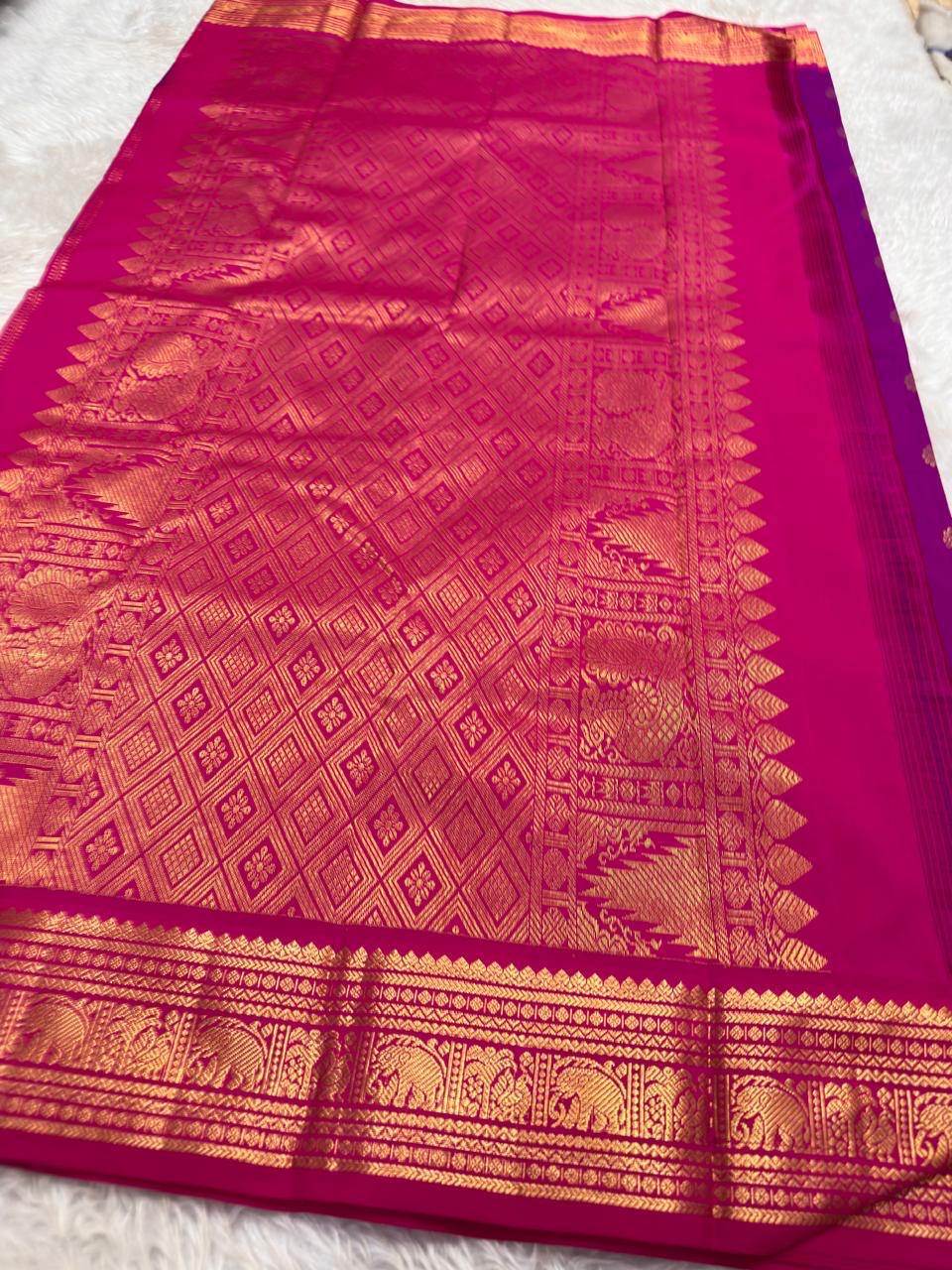 Traditional violet silk saree with richly detailed korvai border craftsmanship