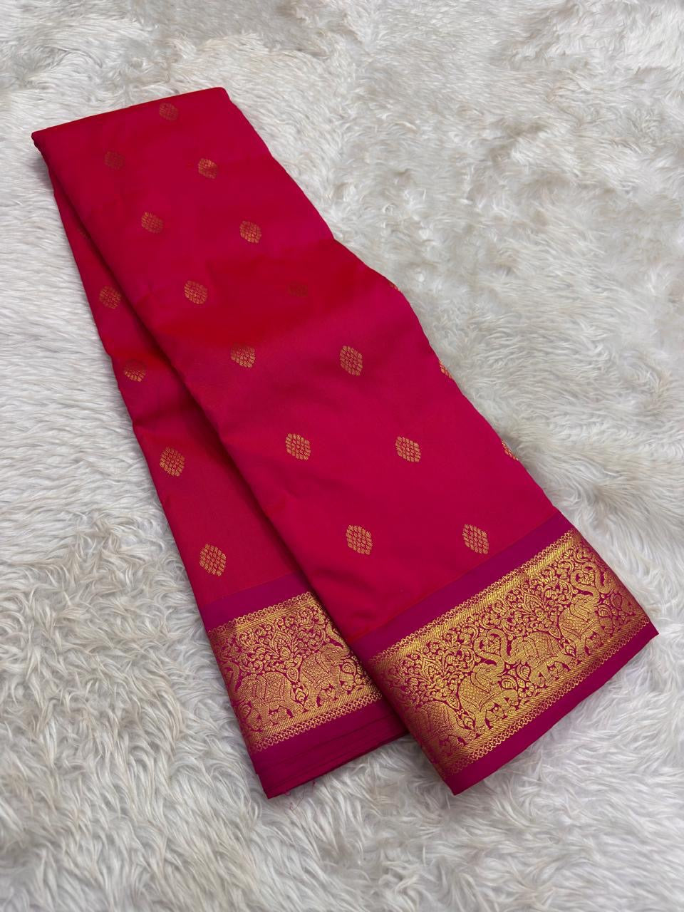 Pure Kanchipuram silk saree with jewel-toned violet body and zari motifs