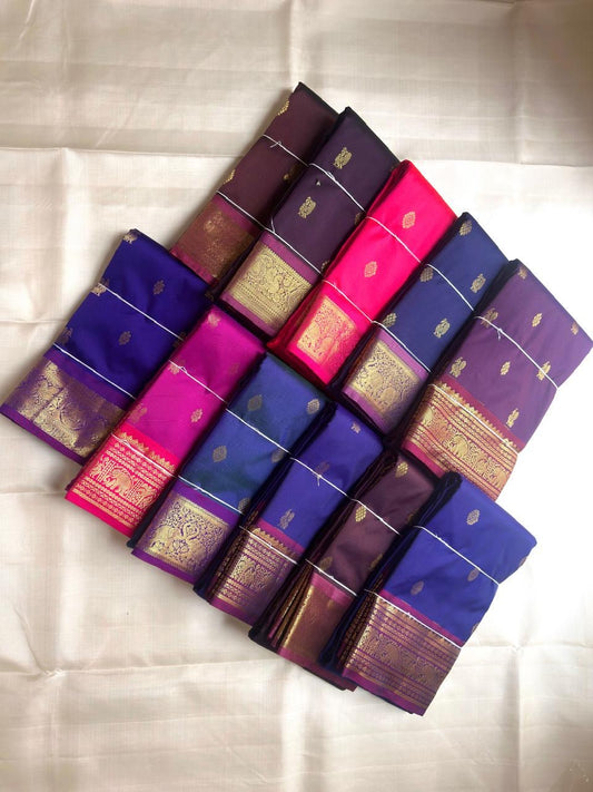 Imperial violet lightweight Kanchipuram silk saree with mayil chakram butta motifs and rich zari border