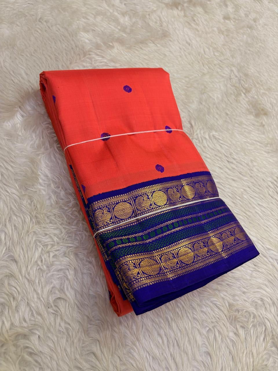 Indian wedding Kanchipuram silk saree coral sunset orange with royal violet border